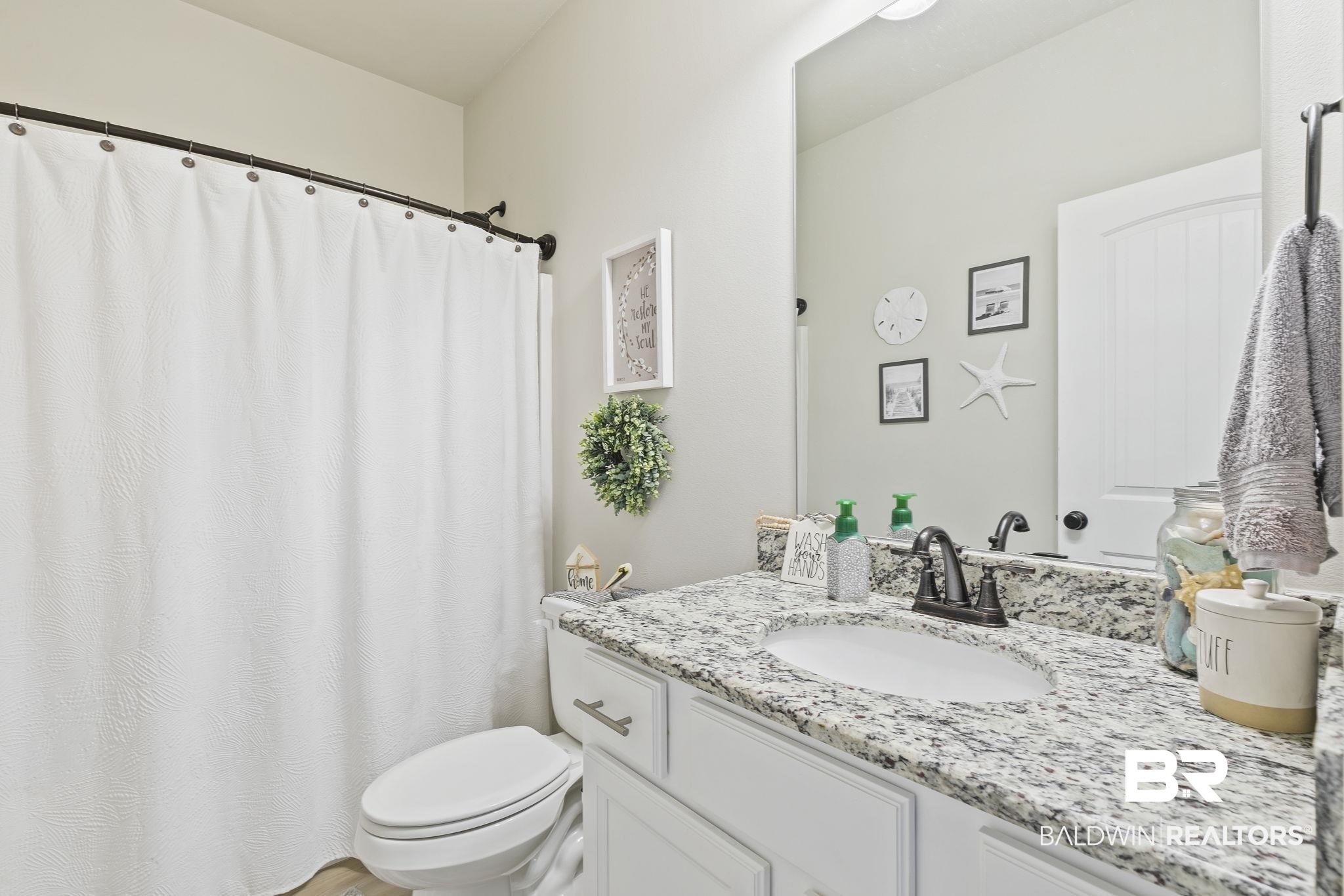 910 Gibson Court Foley, AL 36535 - Photo 31 of 66 Featuring nice white cabinetry, LVP flooring and nice light fixtures