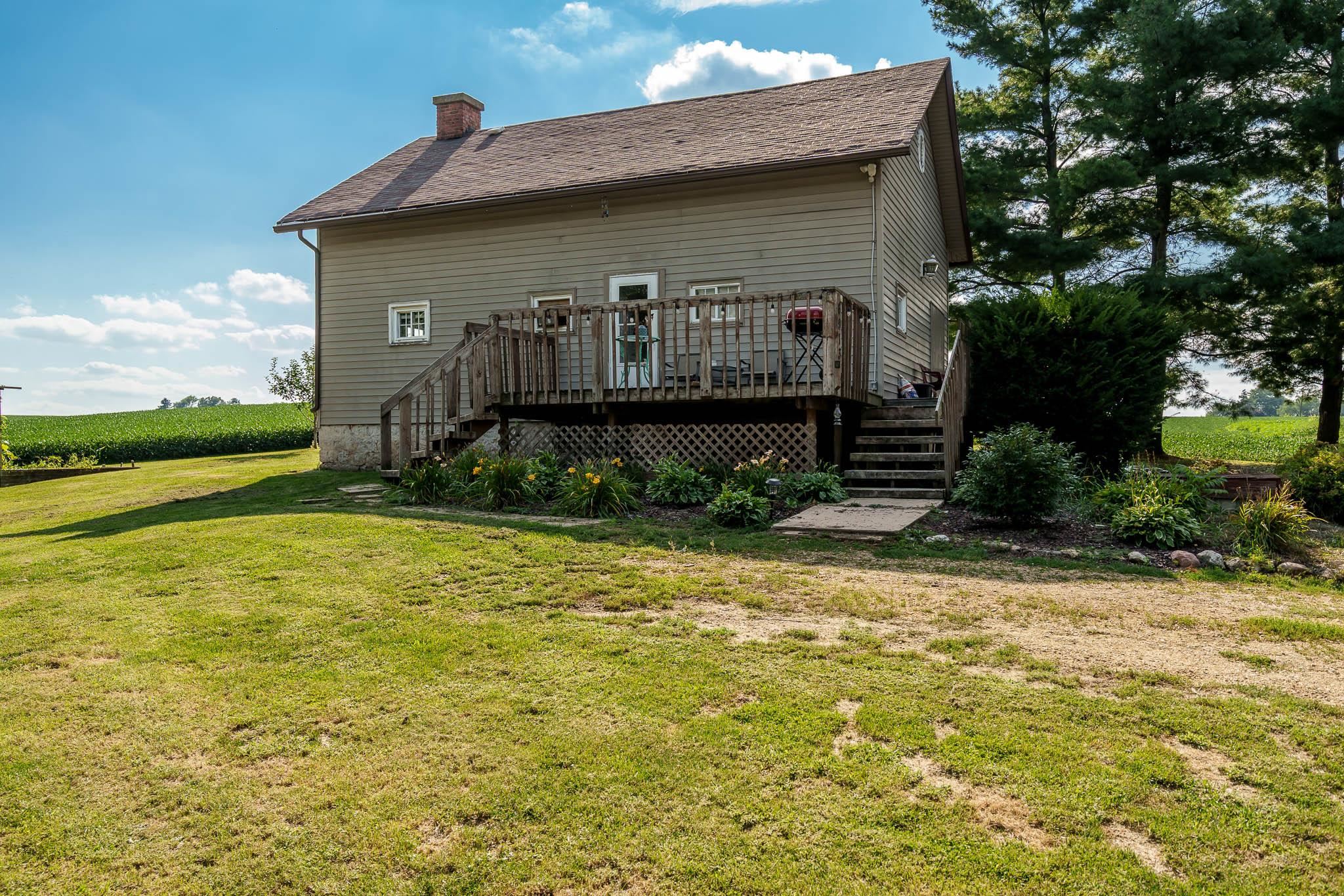 6913 West Wagner Road German Valley, IL 61039 - Photo 1 of 54 a view of a house with backyard and garden