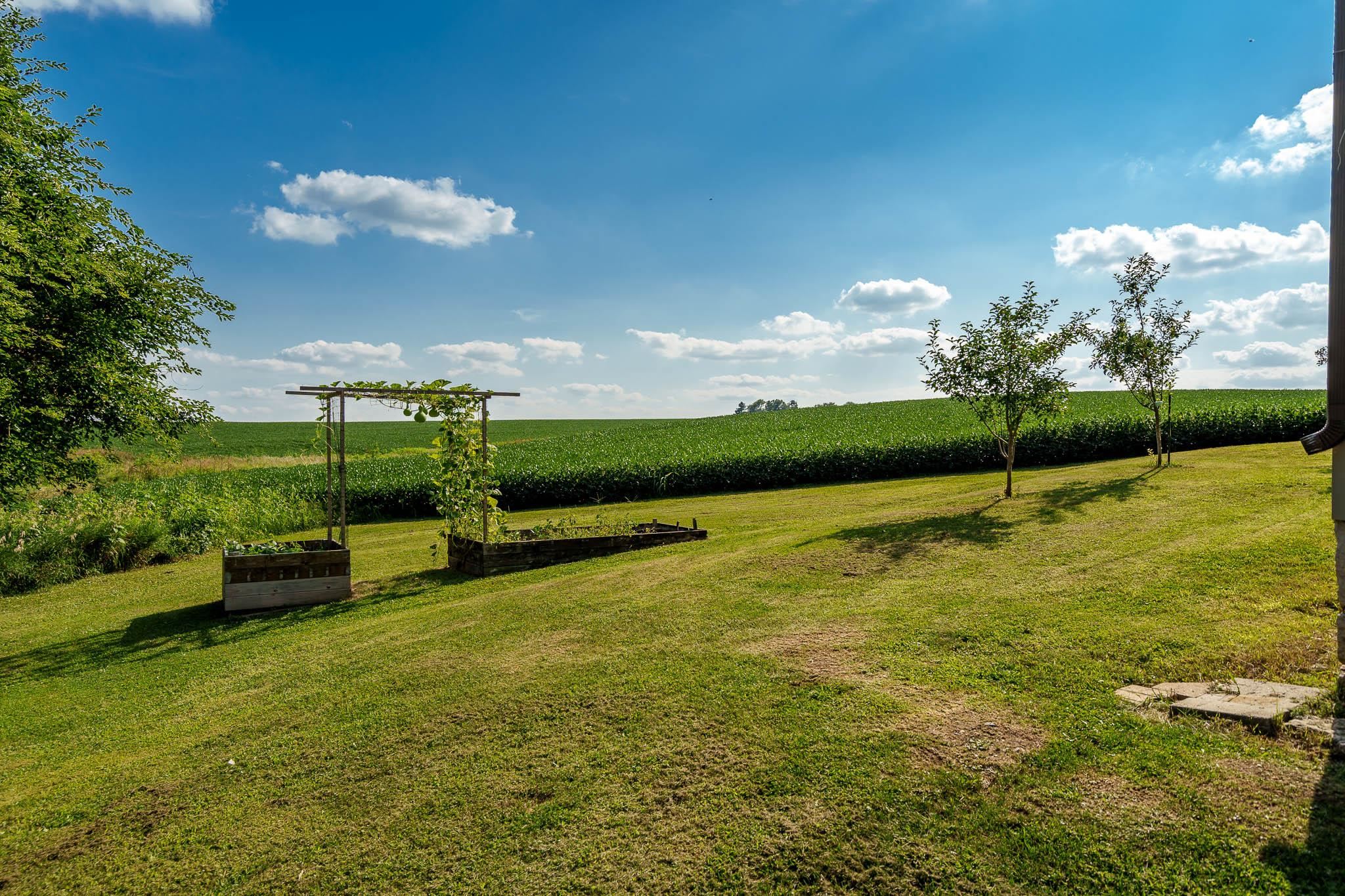 6913 West Wagner Road German Valley, IL 61039 - Photo 23 of 54 a view of a garden with lawn chairs