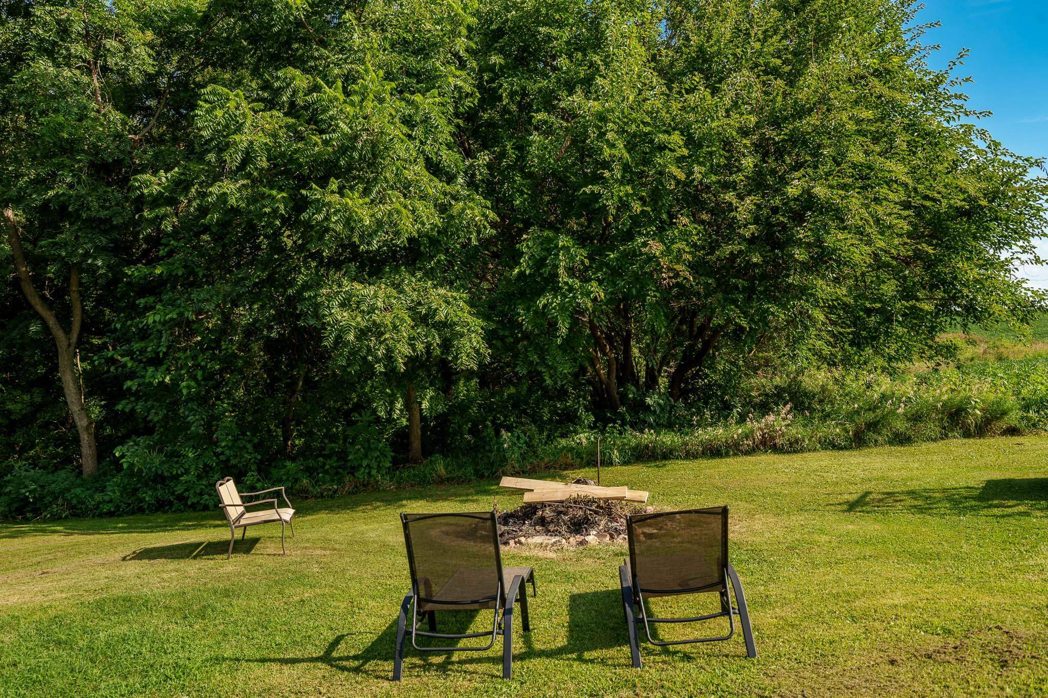 6913 West Wagner Road German Valley, IL 61039 - Photo 24 of 54 a view of a chair and tables on the wooden floor