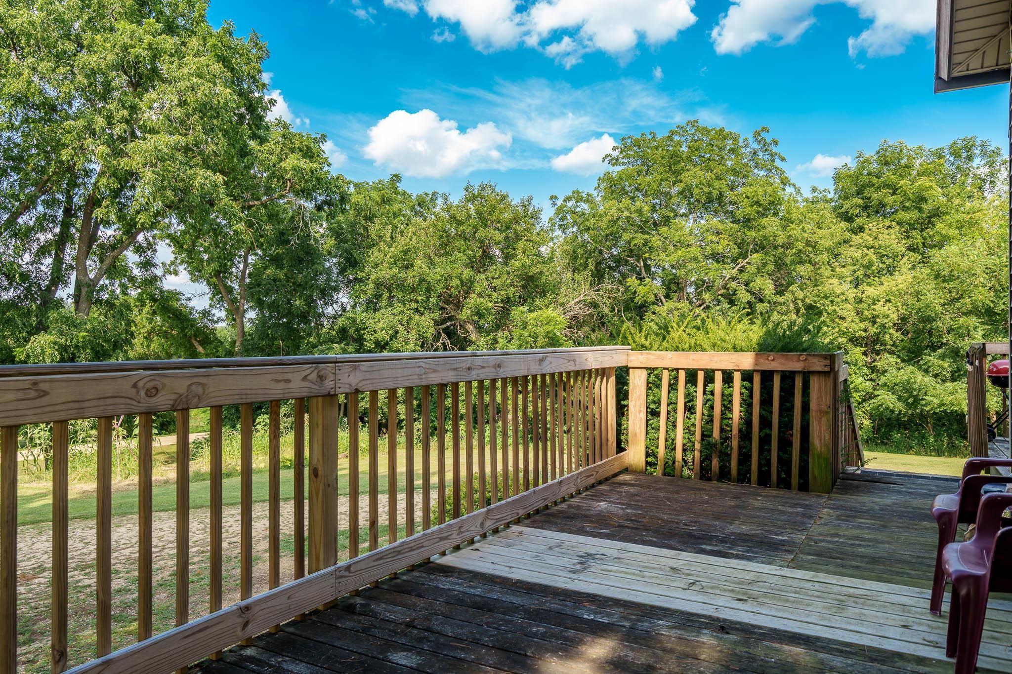 6913 West Wagner Road German Valley, IL 61039 - Photo 33 of 54 a balcony with trees in the background