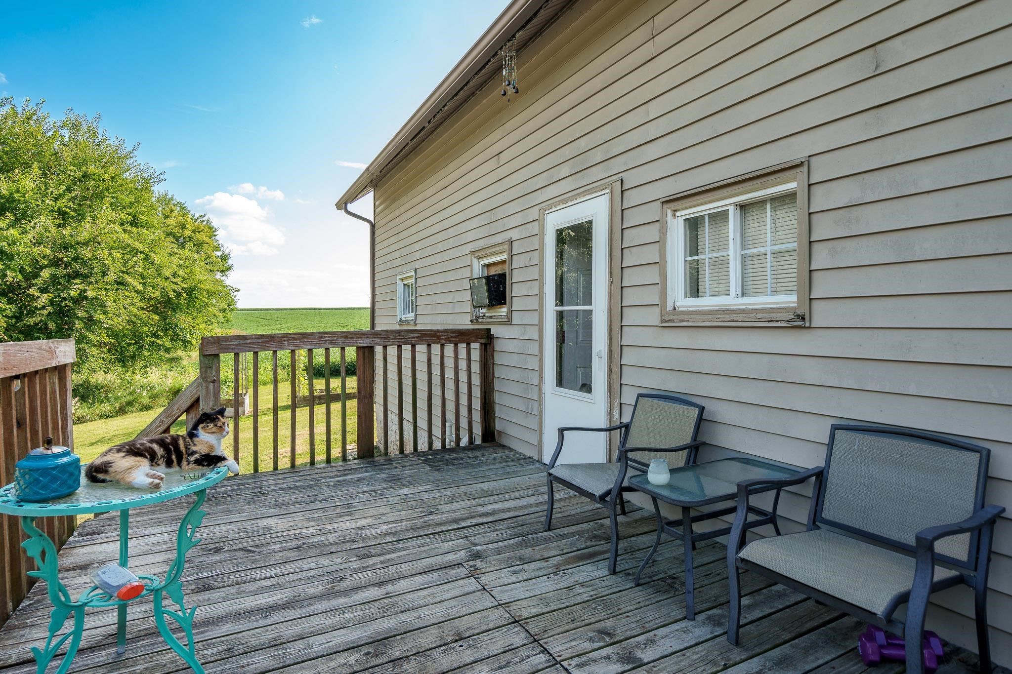 6913 West Wagner Road German Valley, IL 61039 - Photo 36 of 54 a view of a deck with furniture