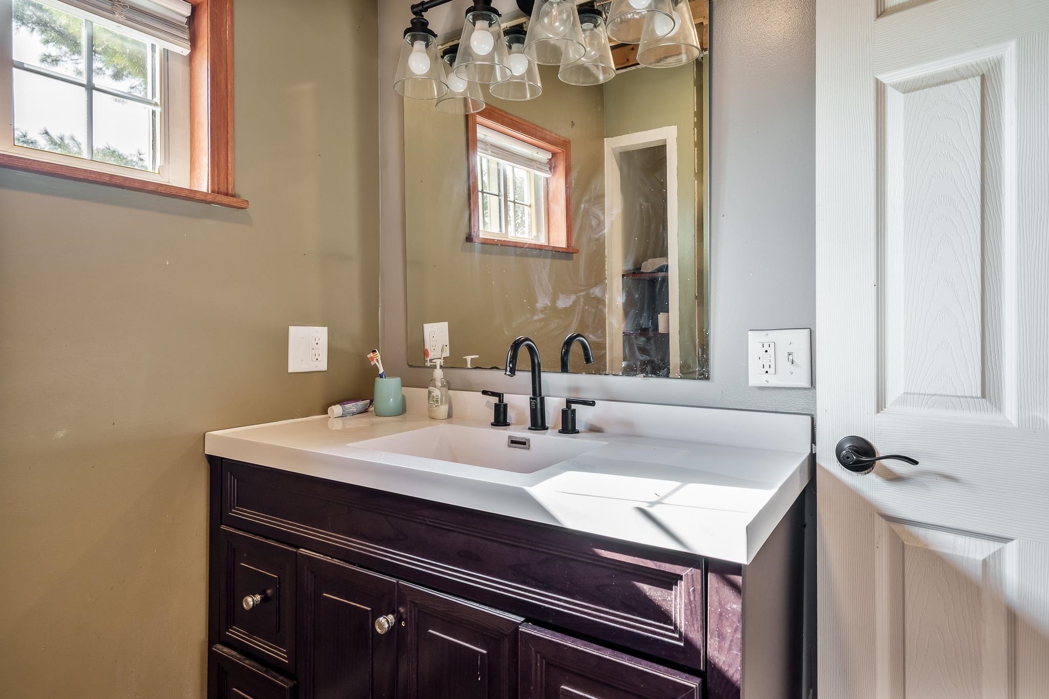 6913 West Wagner Road German Valley, IL 61039 - Photo 49 of 54 a bathroom with a sink and a mirror