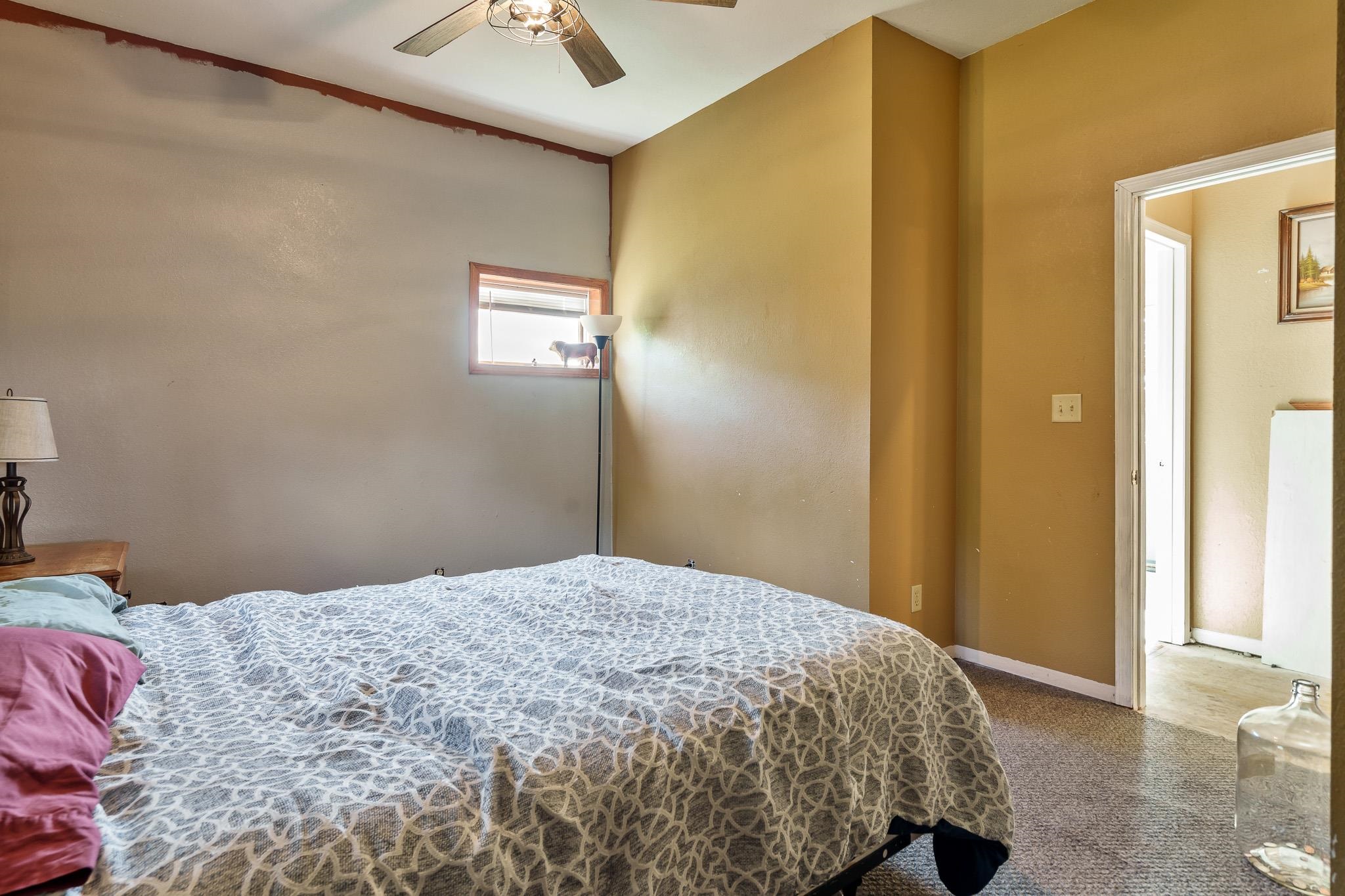 6913 West Wagner Road German Valley, IL 61039 - Photo 51 of 54 a bedroom with a bed and a chandelier