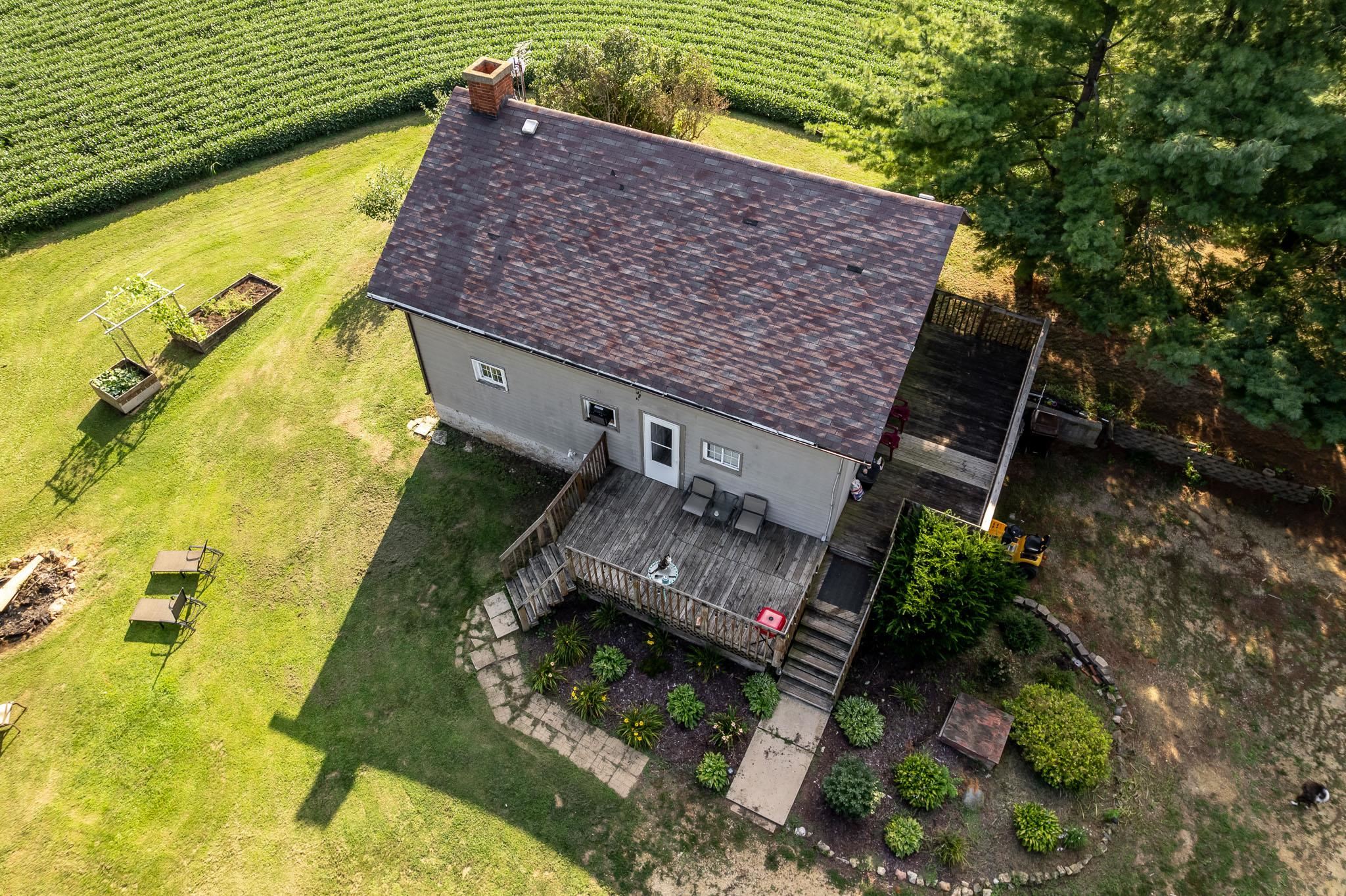 6913 West Wagner Road German Valley, IL 61039 - Photo 8 of 54 a aerial view of a house with a garden and plants