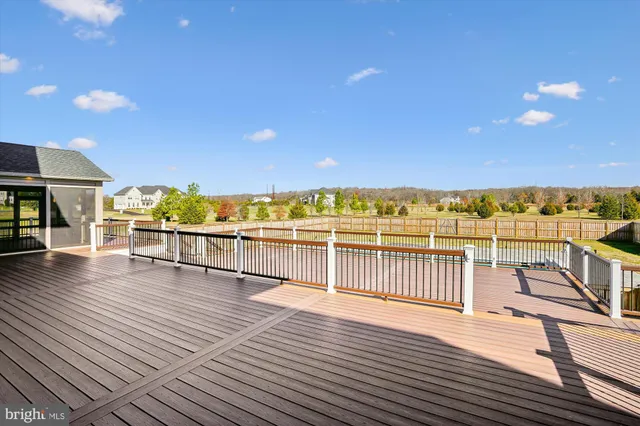 a view of a balcony with wooden floor