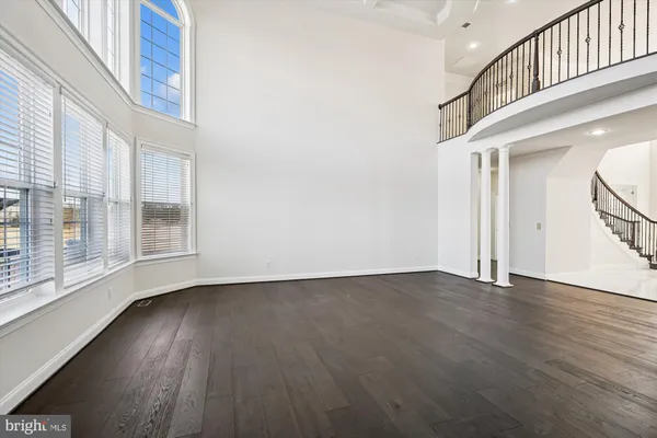 a view of a livingroom with furniture and stairs