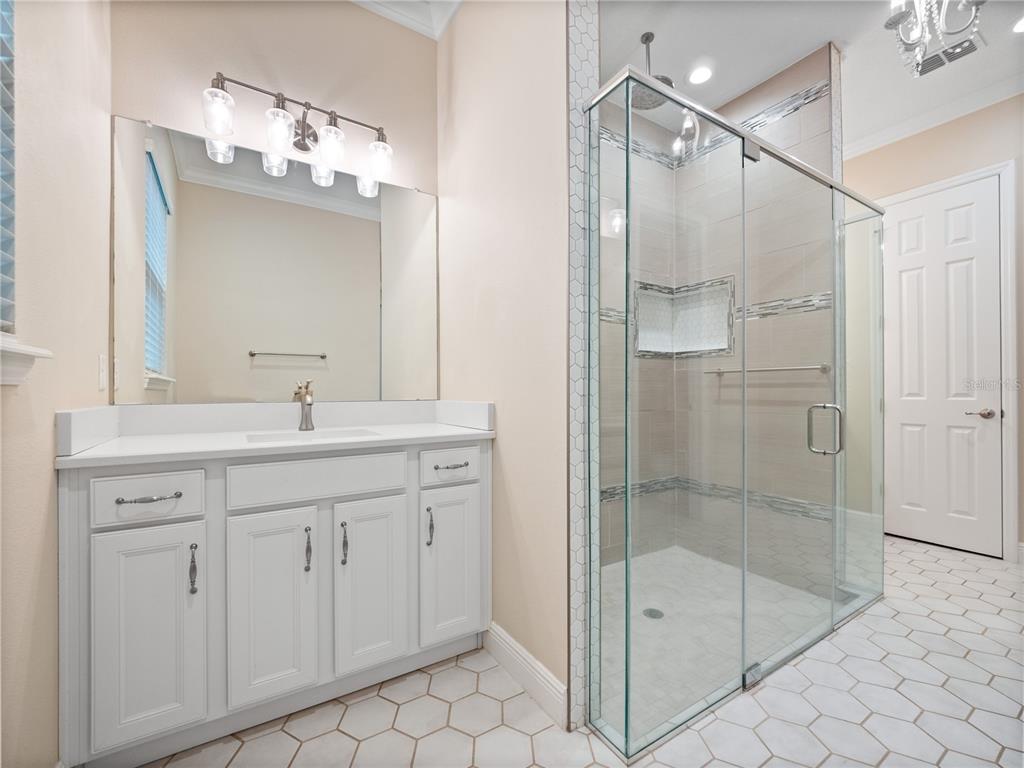 2922 Reef Knot Place Winter Park, FL 32792 - Photo 23 of 49 a bathroom with a shower sink and mirror