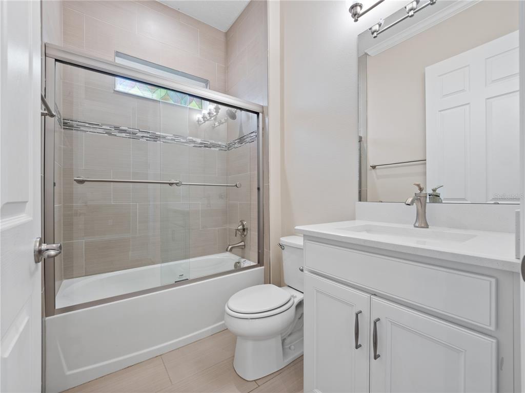 2922 Reef Knot Place Winter Park, FL 32792 - Photo 25 of 49 a bathroom with a sink toilet and shower