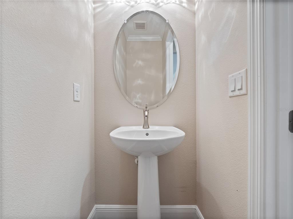 2922 Reef Knot Place Winter Park, FL 32792 - Photo 29 of 49 a room with a sink and a mirror