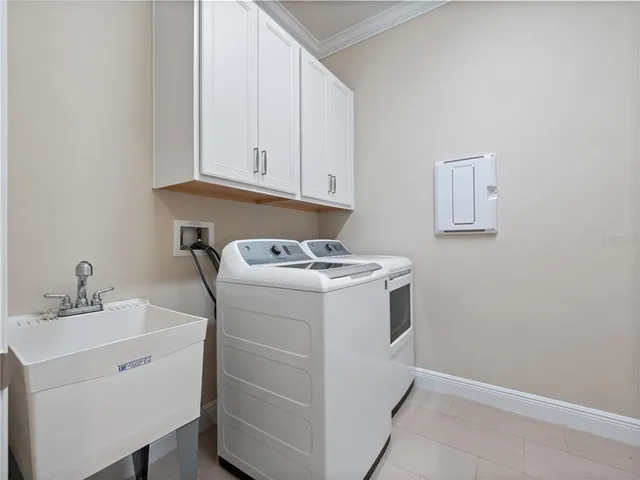 an empty room with wooden floor and a ceiling fan
