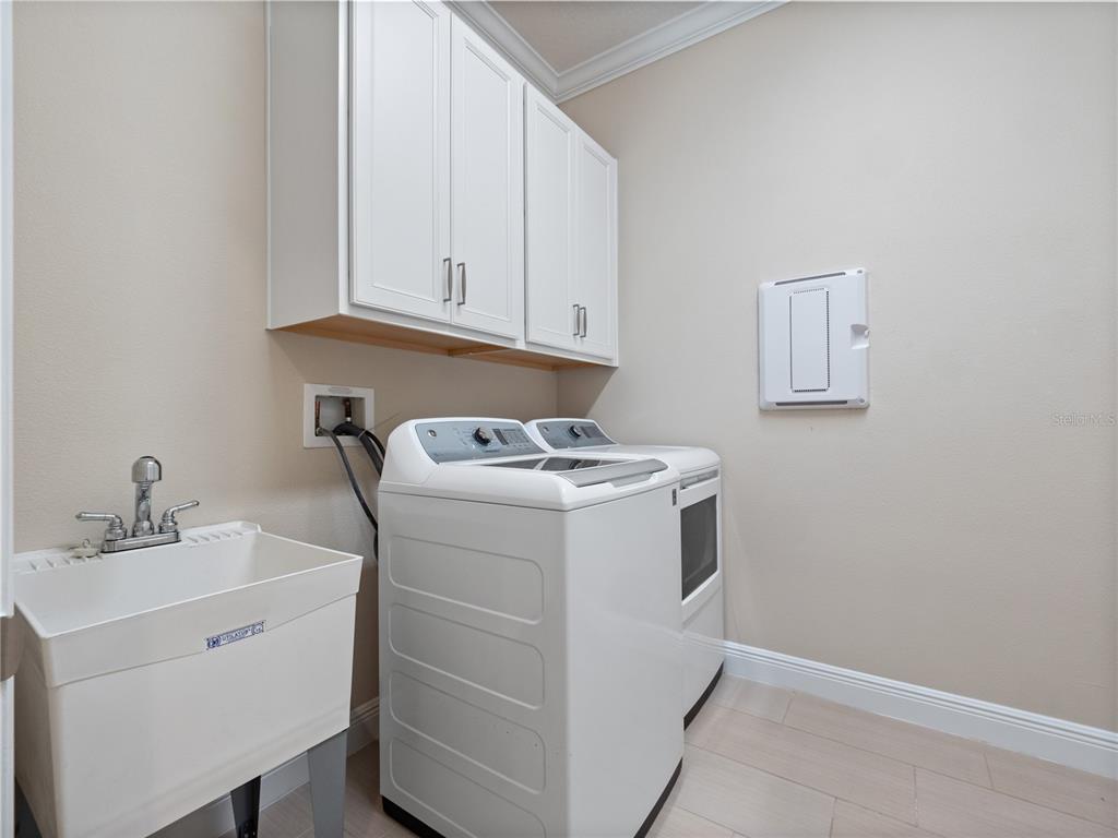 2922 Reef Knot Place Winter Park, FL 32792 - Photo 30 of 49 a utility room with dryer and washer