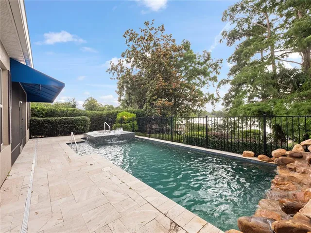 a view of a backyard with sitting area