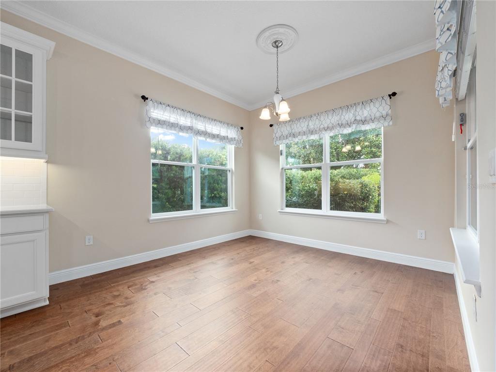 2922 Reef Knot Place Winter Park, FL 32792 - Photo 36 of 49 a view of an empty room with windows and chandelier