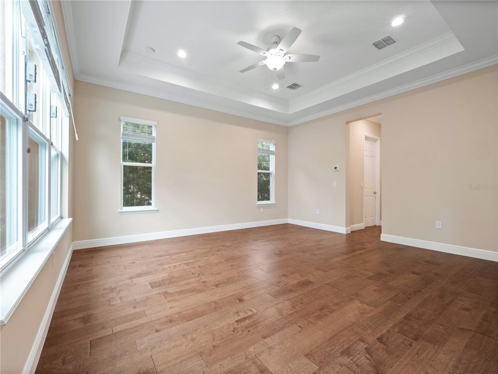 2922 Reef Knot Place Winter Park, FL 32792 - Photo 39 of 49 an empty room with wooden floor and windows