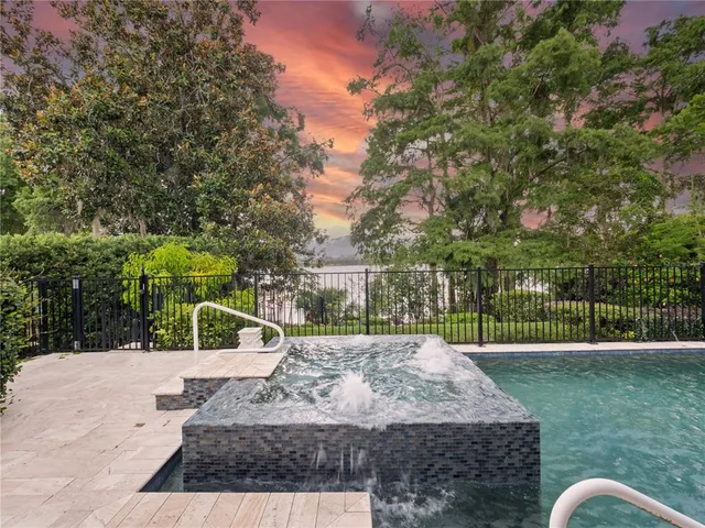 a view of a backyard with sitting area