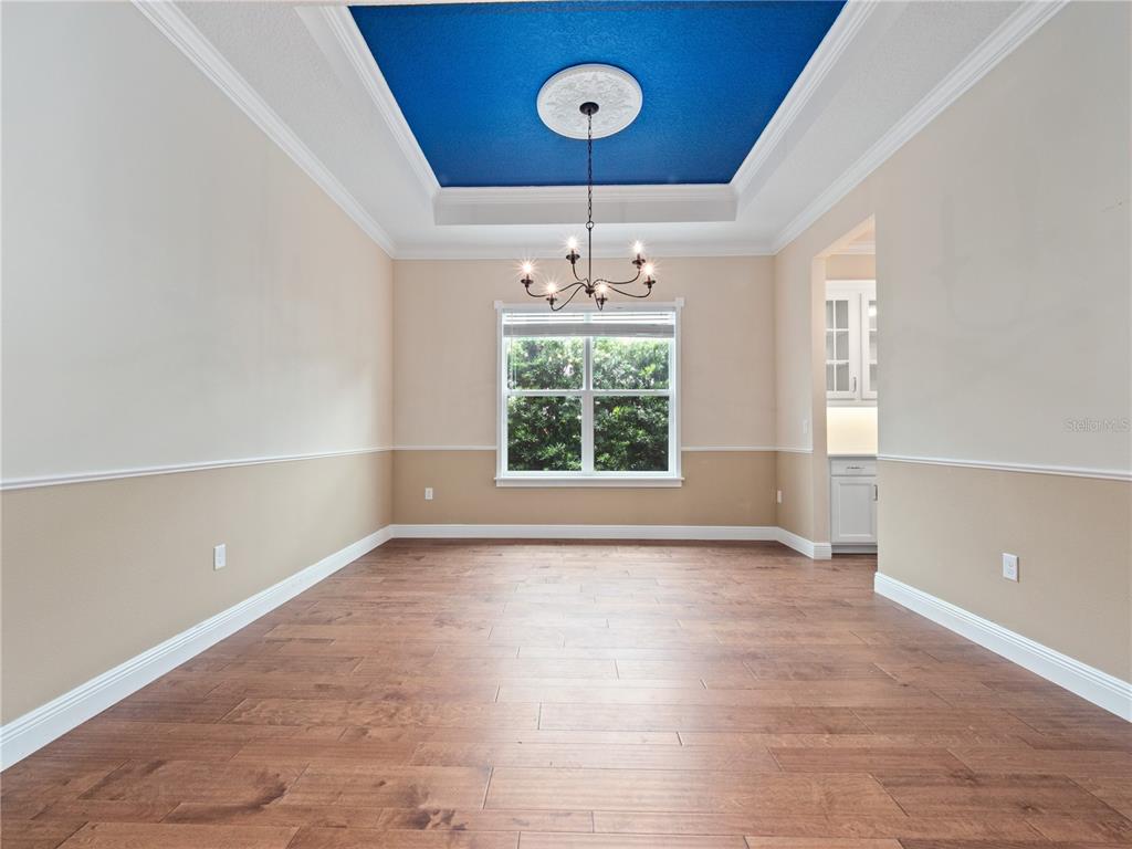 2922 Reef Knot Place Winter Park, FL 32792 - Photo 42 of 49 a view of an empty room with a window and wooden floor