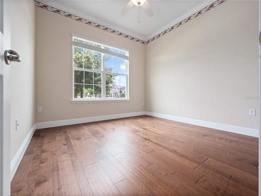 2922 Reef Knot Place Winter Park, FL 32792 - Photo 43 of 49 an empty room with wooden floor and windows