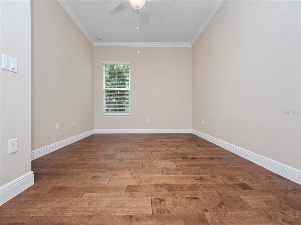 2922 Reef Knot Place Winter Park, FL 32792 - Photo 44 of 49 a view of empty room with wooden floor and fan