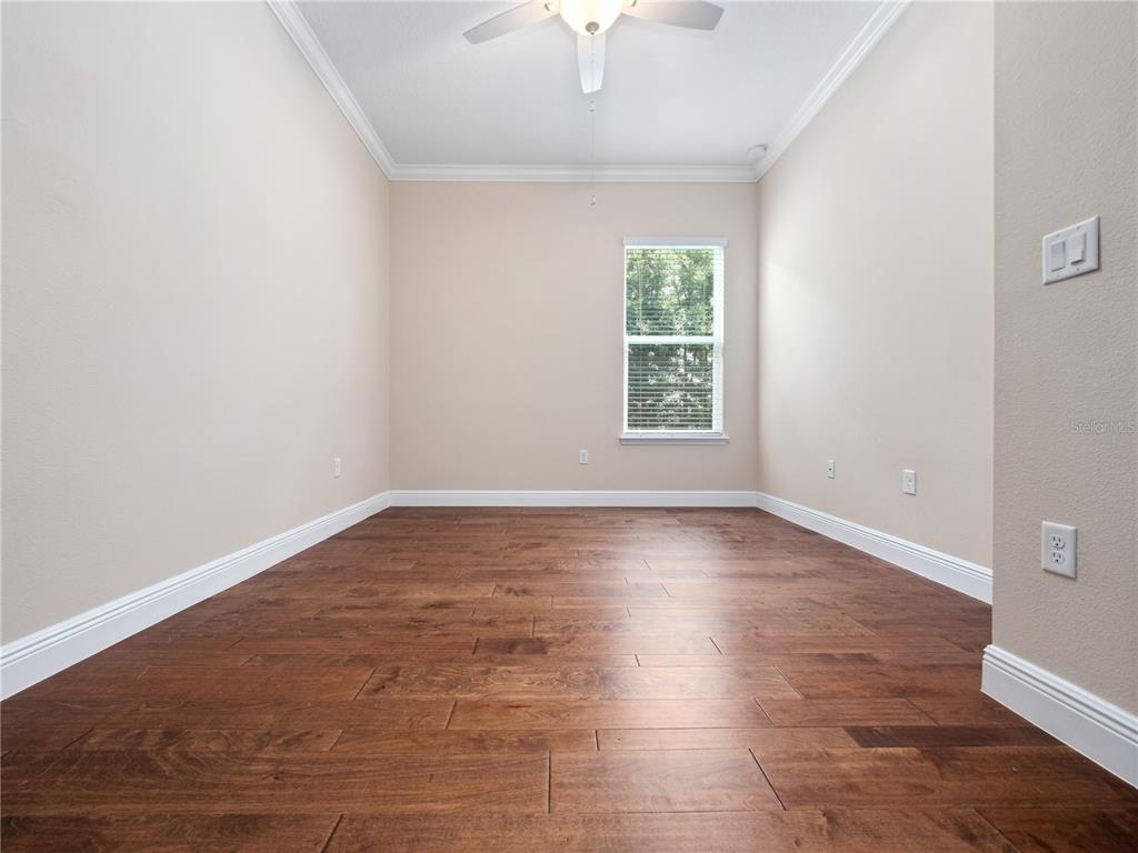 2922 Reef Knot Place Winter Park, FL 32792 - Photo 45 of 49 an empty room with wooden floor and windows