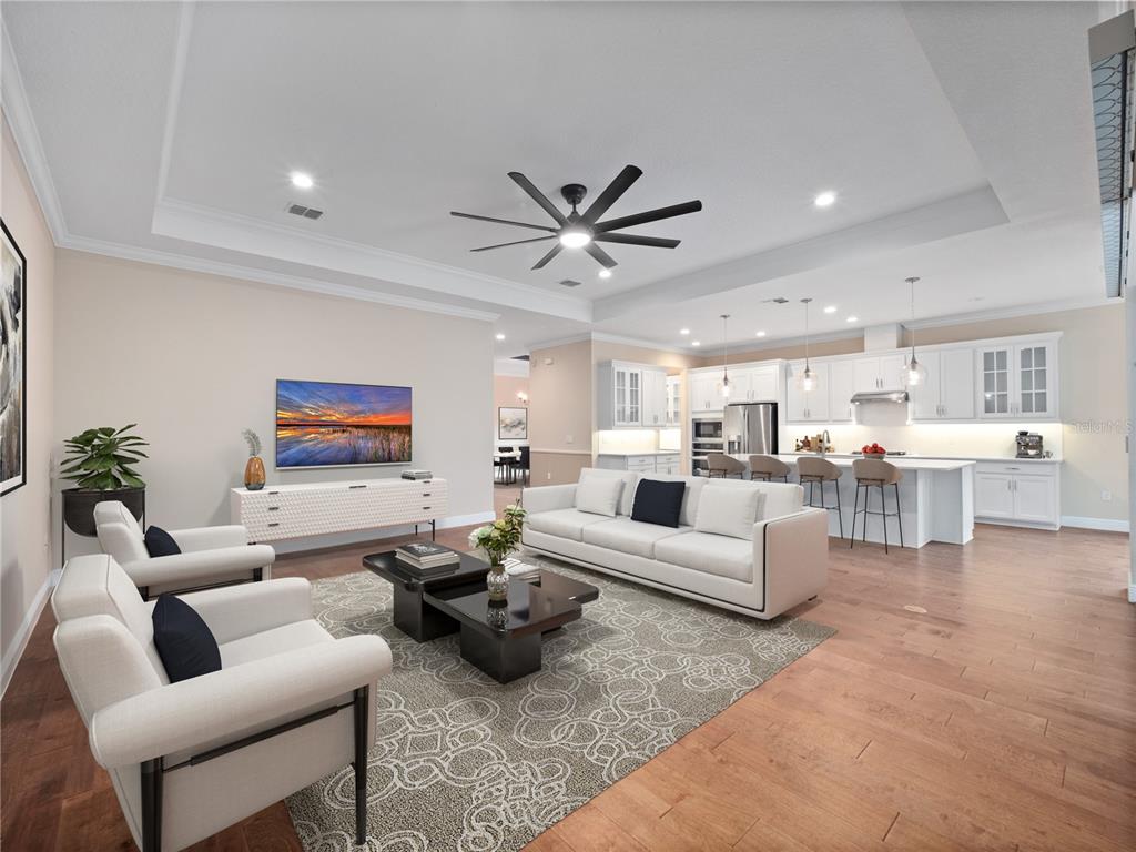 2922 Reef Knot Place Winter Park, FL 32792 - Photo 7 of 49 a living room with furniture kitchen view and a chandelier