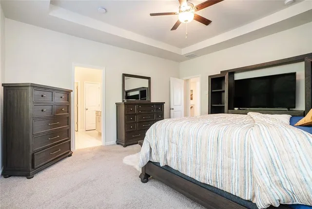 a bed room with a bed and a television