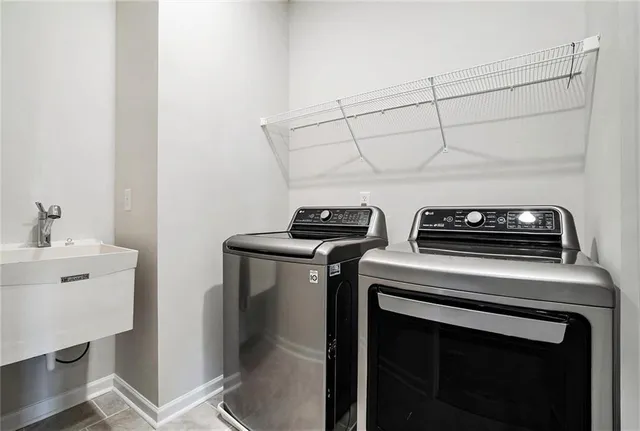a utility room with dryer and washer