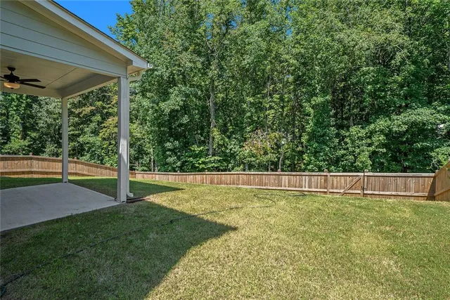 a view of swimming pool with a yard