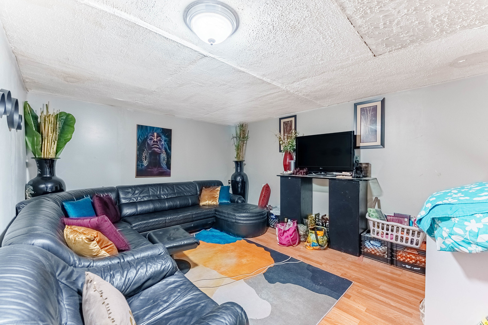 4148 West 19th Street Chicago, IL 60623 - Photo 14 of 21 a living room with furniture and a flat screen tv