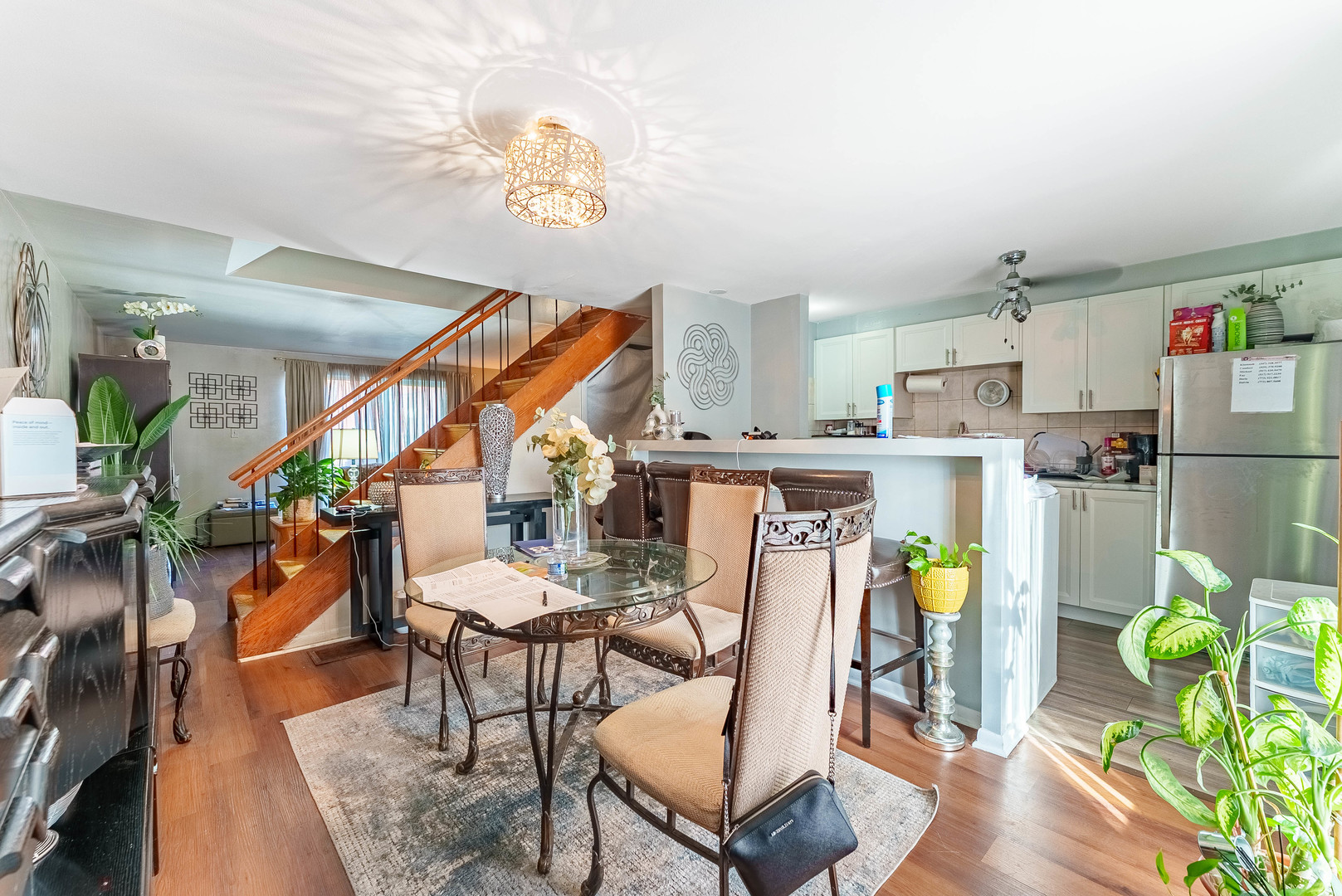 4148 West 19th Street Chicago, IL 60623 - Photo 2 of 21 a dining room filled with furniture and a chandelier