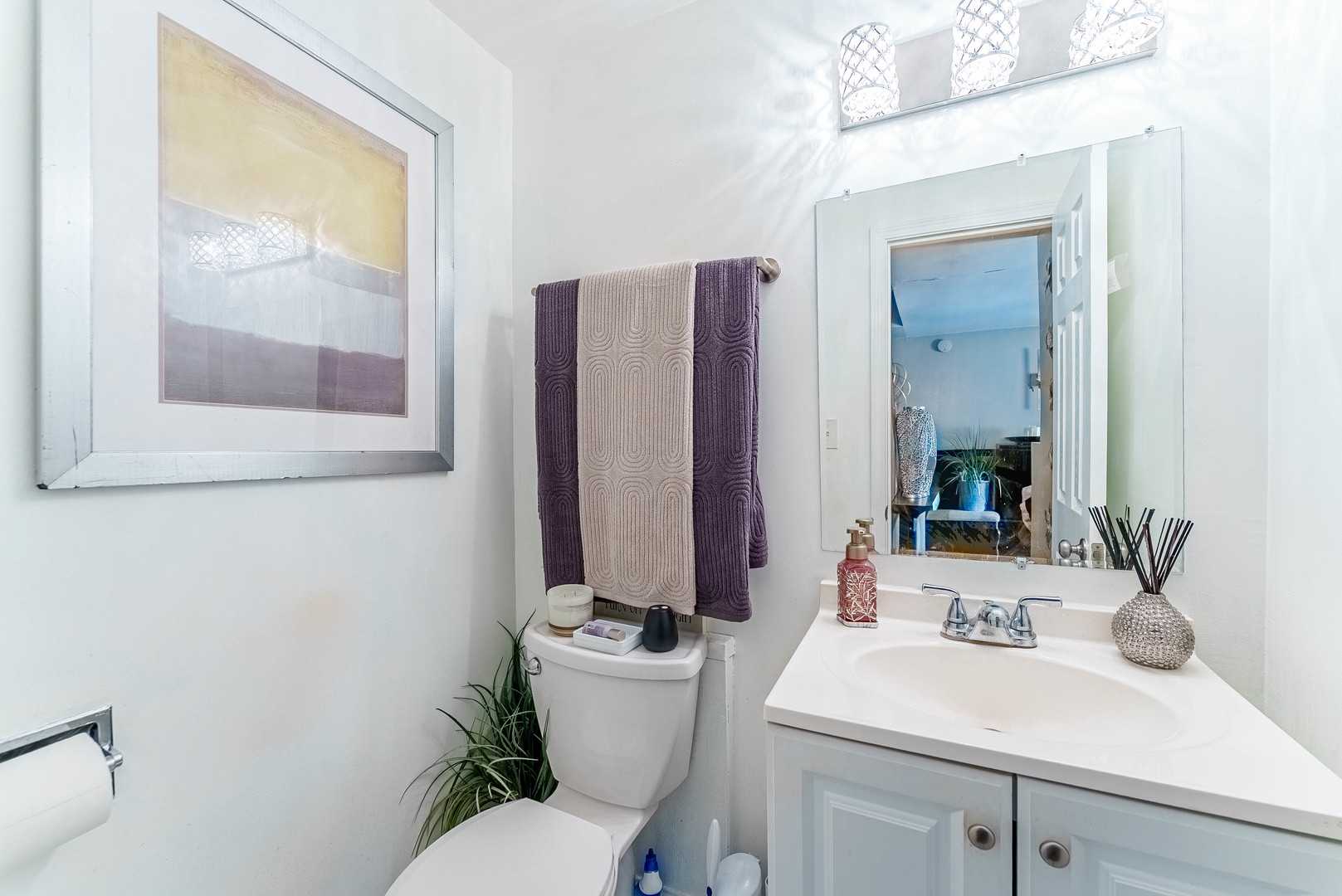 4148 West 19th Street Chicago, IL 60623 - Photo 8 of 21 a bathroom with a sink toilet and mirror
