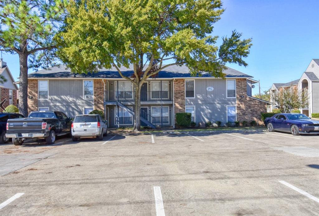 3815 Stuart Road, Unit 2BR2BATH Denton, TX 76209 - Photo 14 of 15 a front view of a house with a yard and garage