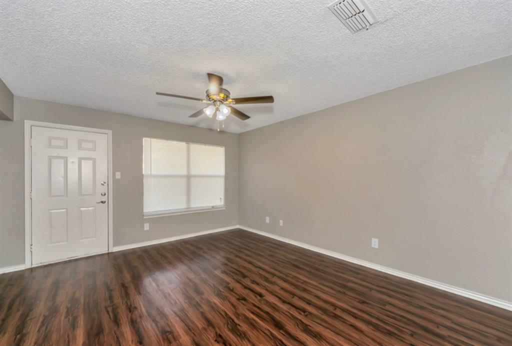 3815 Stuart Road, Unit 2BR2BATH Denton, TX 76209 - Photo 4 of 15 wooden floor in an empty room with a window