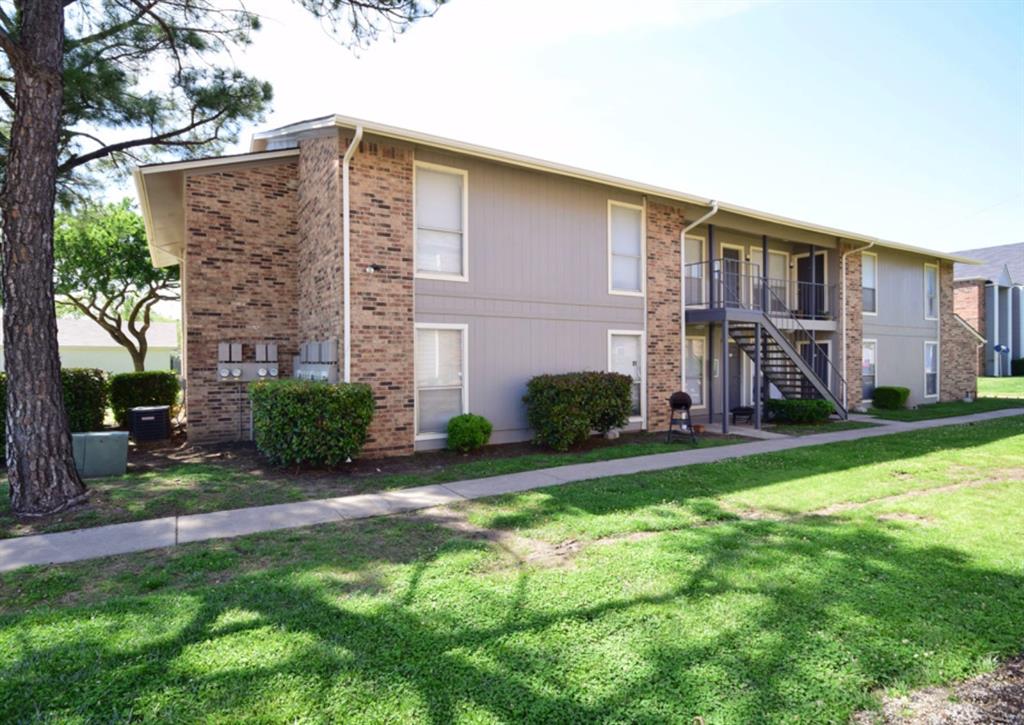 3815 Stuart Road, Unit 2BR2BATH Denton, TX 76209 - Photo 9 of 15 a view of a house with a yard and plants