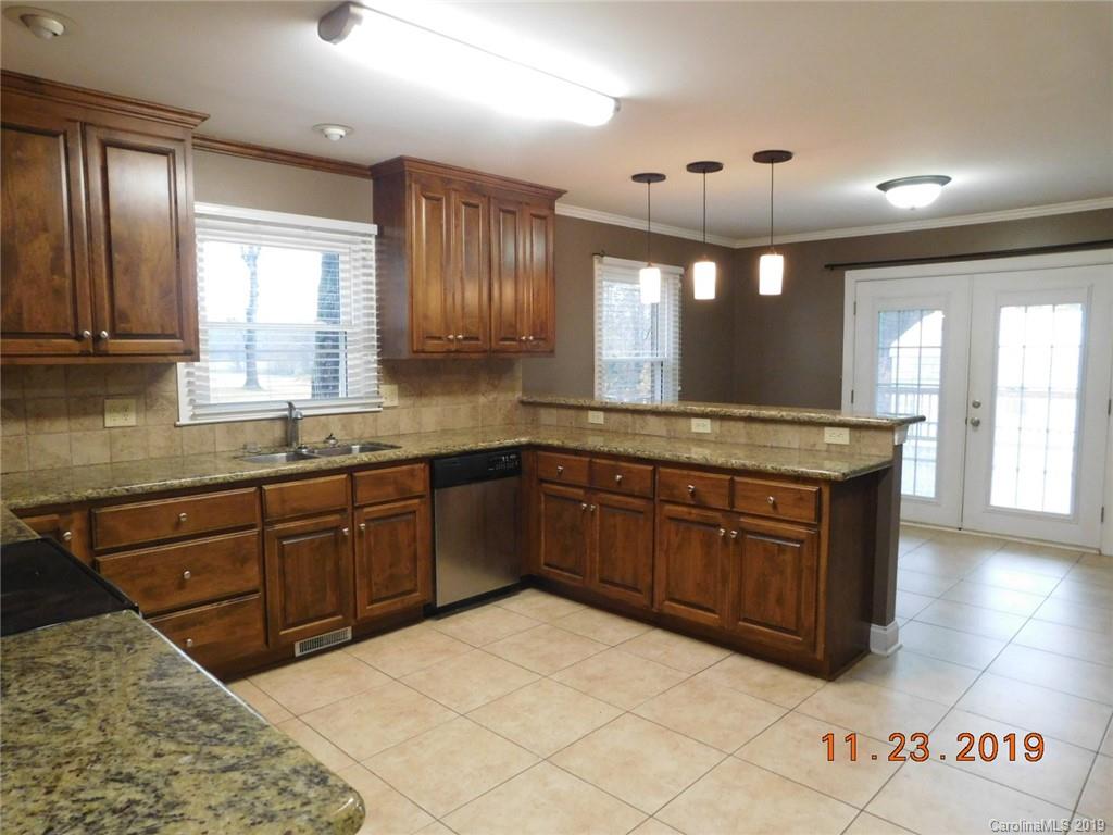 4020 Sincerity Road Monroe, NC 28110 - Photo 2 of 23 a kitchen with a sink and cabinets