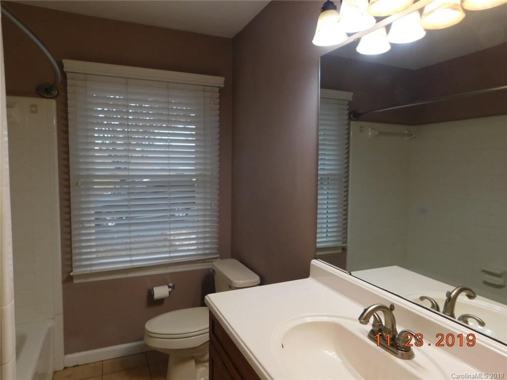 4020 Sincerity Road Monroe, NC 28110 - Photo 12 of 23 a bathroom with a sink a toilet and a mirror