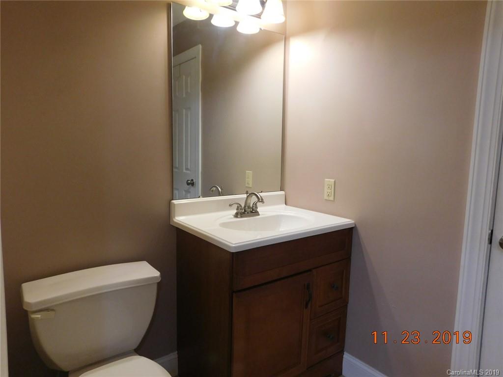 4020 Sincerity Road Monroe, NC 28110 - Photo 16 of 23 a bathroom with a toilet sink and mirror