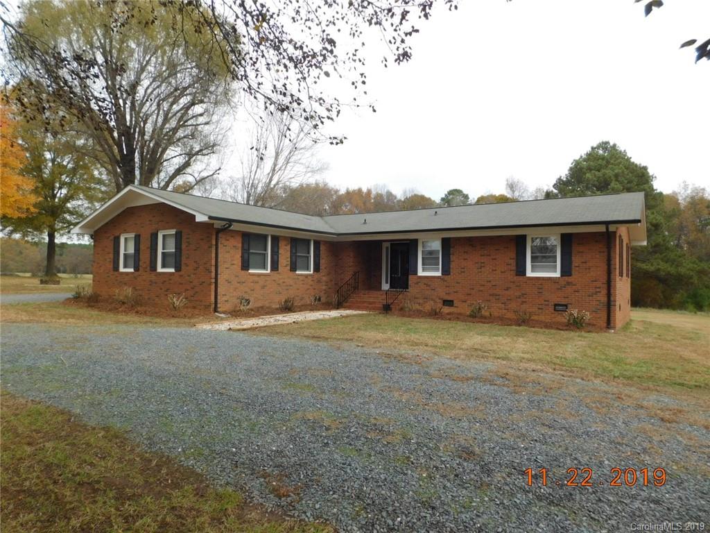 4020 Sincerity Road Monroe, NC 28110 - Photo 17 of 23 a front view of a house with a garden