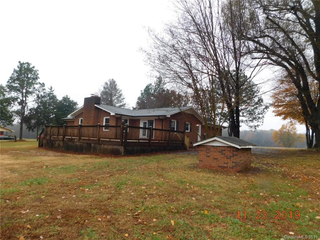 4020 Sincerity Road Monroe, NC 28110 - Photo 19 of 23 a view of a large house with a big yard and large tree