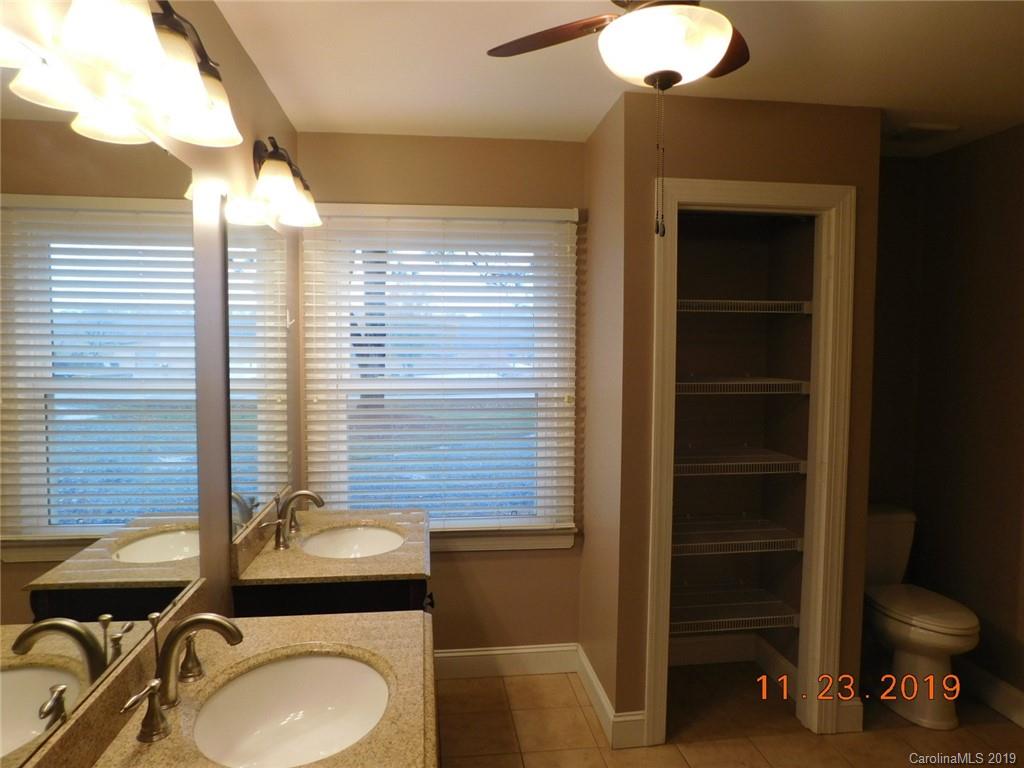 4020 Sincerity Road Monroe, NC 28110 - Photo 9 of 23 a bathroom with a toilet sink and mirror