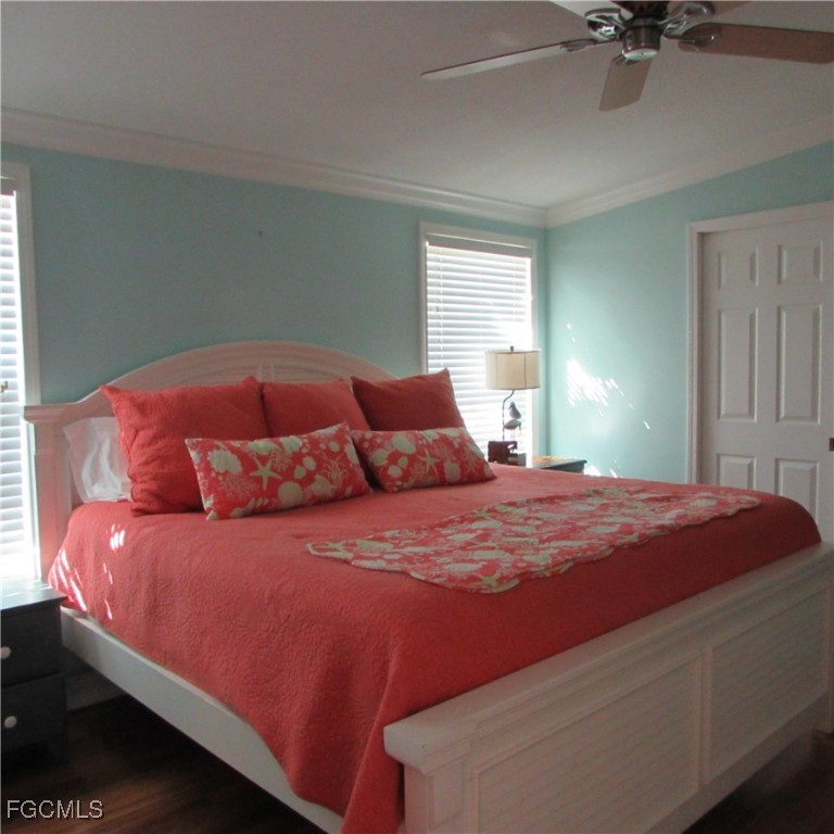5371 Blue Crab Circle, Unit 1 Bokeelia, FL 33922 - Photo 14 of 44 a bedroom with a bed and a window