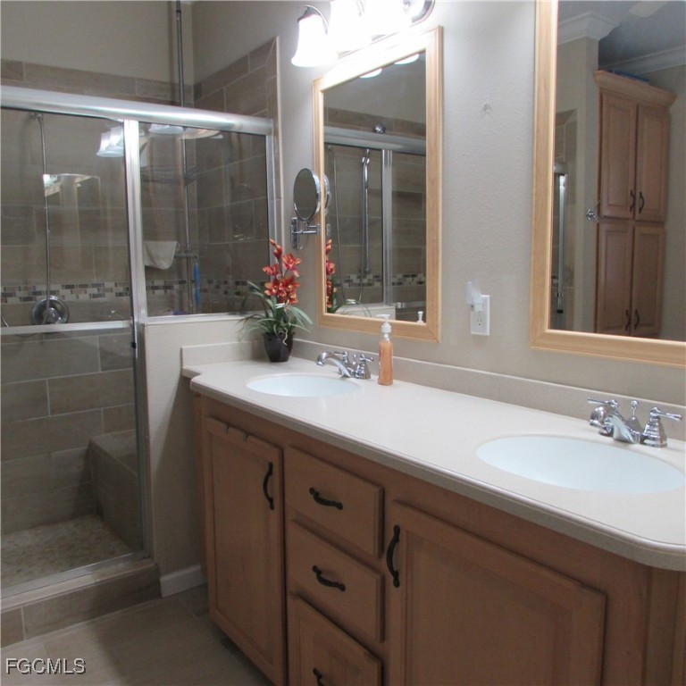 5371 Blue Crab Circle, Unit 1 Bokeelia, FL 33922 - Photo 17 of 44 a bathroom with a sink and a mirror