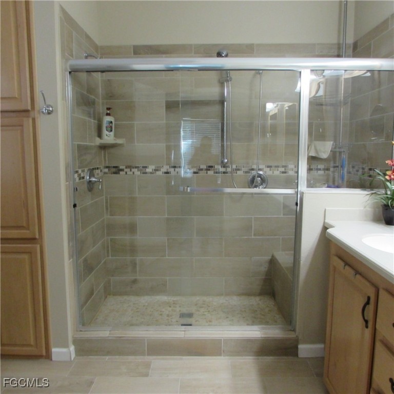 5371 Blue Crab Circle, Unit 1 Bokeelia, FL 33922 - Photo 18 of 44 a bathroom with a shower