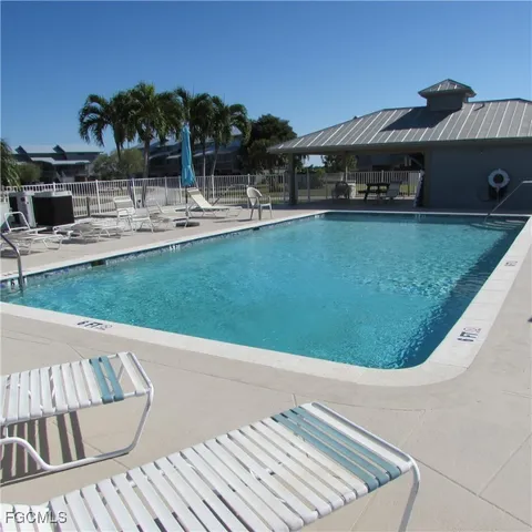 a view of a swimming pool with a patio