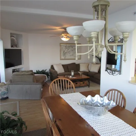 a living room with furniture and flat screen tv