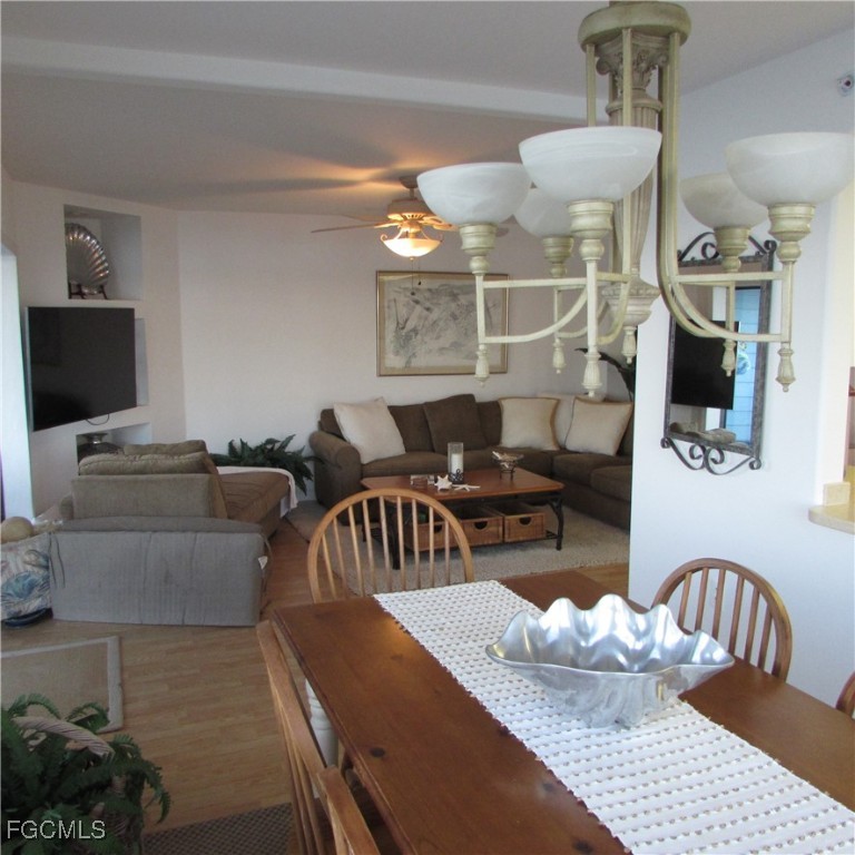 5371 Blue Crab Circle, Unit 1 Bokeelia, FL 33922 - Photo 30 of 44 a living room with furniture and flat screen tv