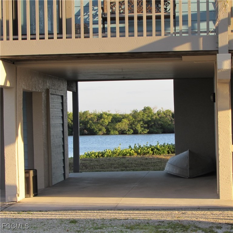 5371 Blue Crab Circle, Unit 1 Bokeelia, FL 33922 - Photo 31 of 44 a view of a house with a porch