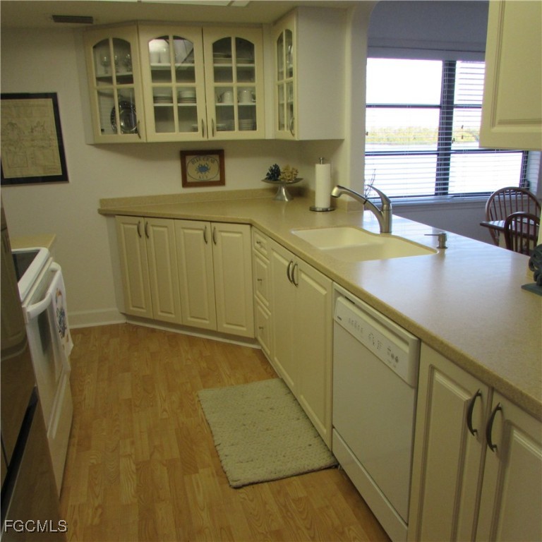 5371 Blue Crab Circle, Unit 1 Bokeelia, FL 33922 - Photo 35 of 44 a bathroom with a sink and a window