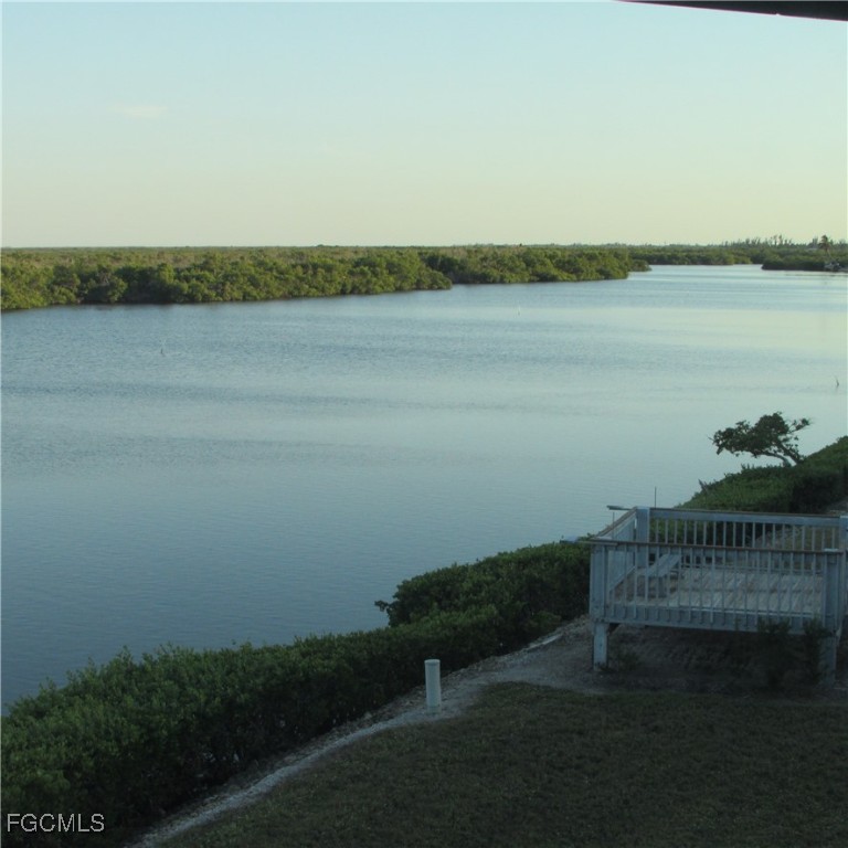 5371 Blue Crab Circle, Unit 1 Bokeelia, FL 33922 - Photo 42 of 44 a view of a lake with a outdoor space