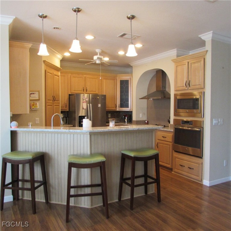 5371 Blue Crab Circle, Unit 1 Bokeelia, FL 33922 - Photo 10 of 44 a kitchen with dining table and chairs